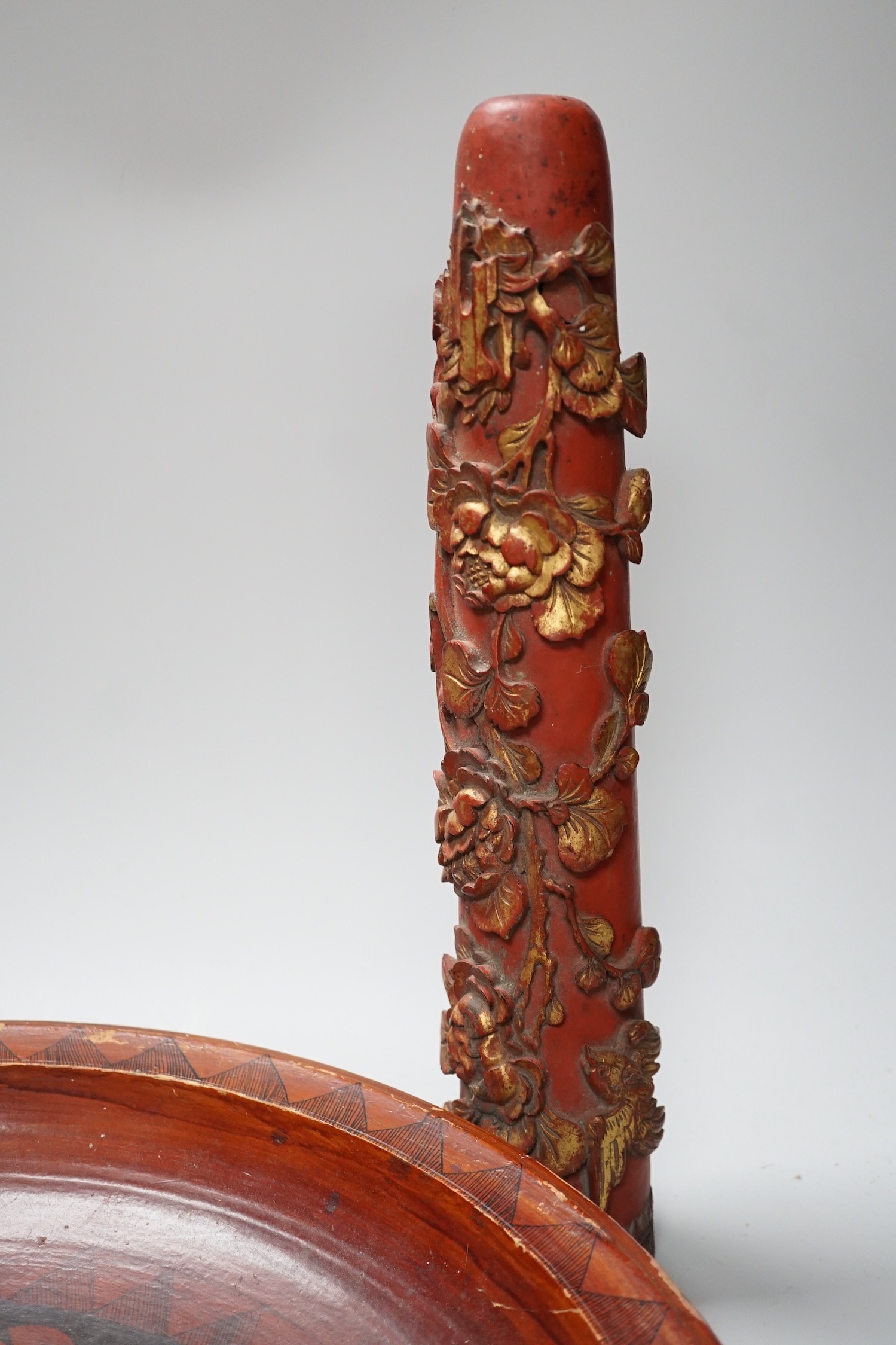A pair of early 20th century Chinese carved red lacquer and gilt temple incense burners and a similar Asian lacquer dish, dish 44.5cms diameter